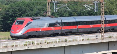 Italy high speed train crossed country at speed, the motor car in the rear.