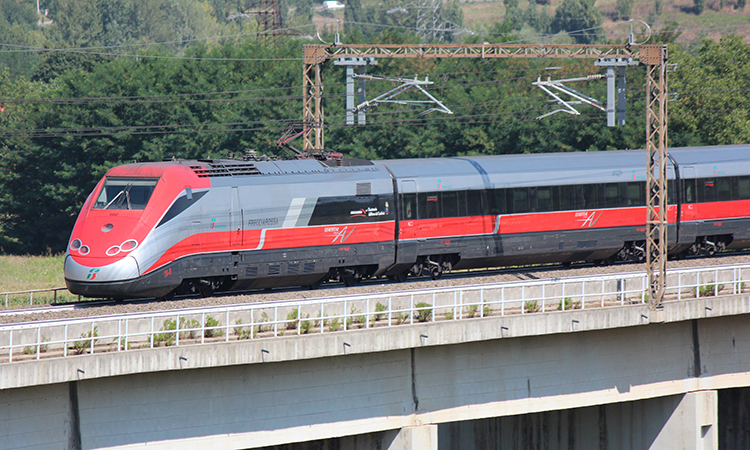 Italy high speed train crossed country at speed, the motor car in the rear.