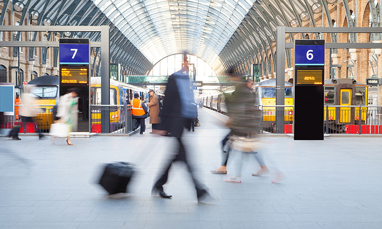 London Train Tube station Blur people movement in rush hour, at King's Cross station,