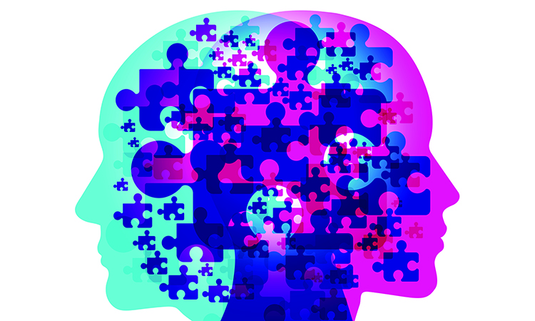Digital render of male and female silhouette with jigsaw pieces used to represent the puzzle of the human mind