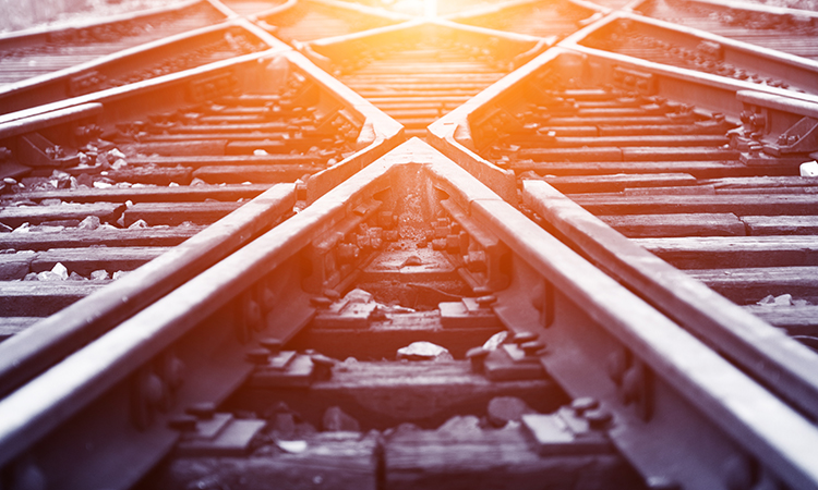 Railway tracks in the sunlight, signifying a new day