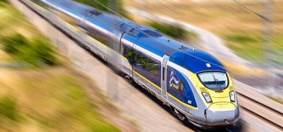 A Eurostar train at high speed in the French countryside.