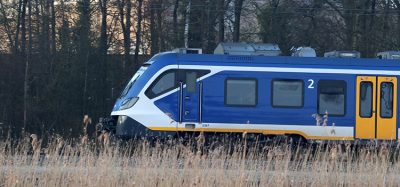 A sprinter train runs along Oude Kene in Hoogeveen, the Netherlands