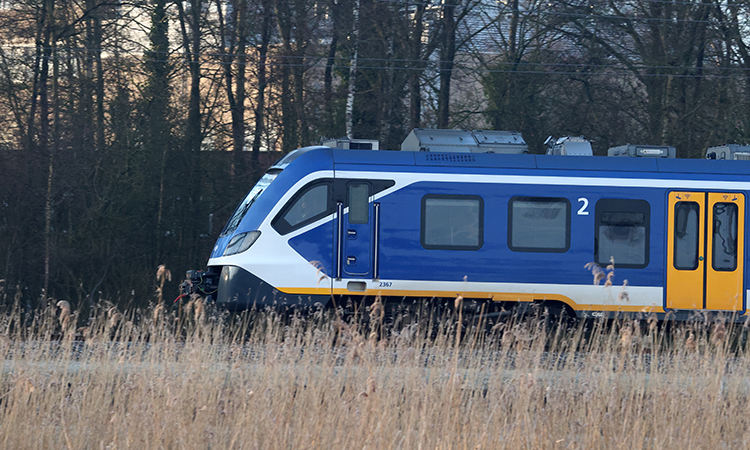 A sprinter train runs along Oude Kene in Hoogeveen, the Netherlands