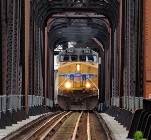 Union Pacific Railway locomotive crossing iron bridge train