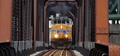 Union Pacific Railway locomotive crossing iron bridge train
