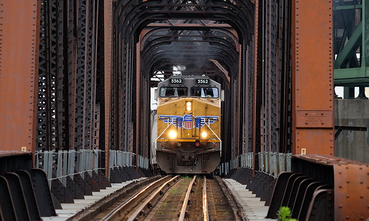 Union Pacific Railway locomotive crossing iron bridge train