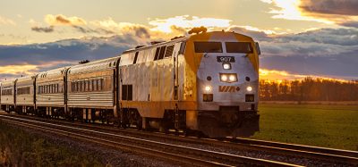 A VIA Rail train travels eastbound to Montreal during sunset