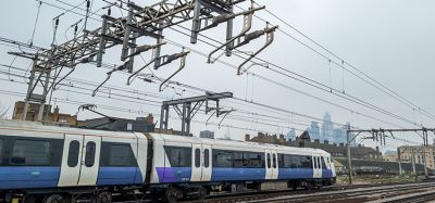 Train running on electric with miles of power lines overhead. A cleaner and more environmentally friendly way to power transport.
