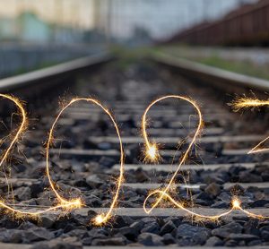 Number 2023 written sparkling sparklers on railway tracks