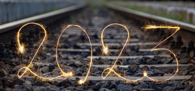 Number 2023 written sparkling sparklers on railway tracks