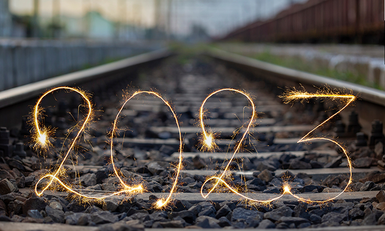 Number 2023 written sparkling sparklers on railway tracks