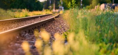 Old railway rails between the grass