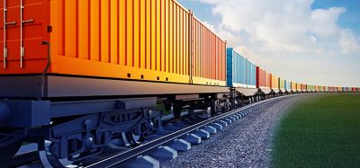 wagon of freight train with containers with a blue sky background