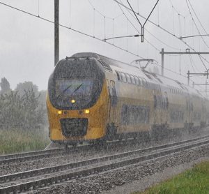 Dutch NS train on a rainy autumn trip in Bunnik (the Netherlands)