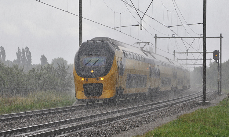 Dutch NS train on a rainy autumn trip in Bunnik (the Netherlands)