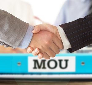 Businessman handshake on mou - memorandum of understanding