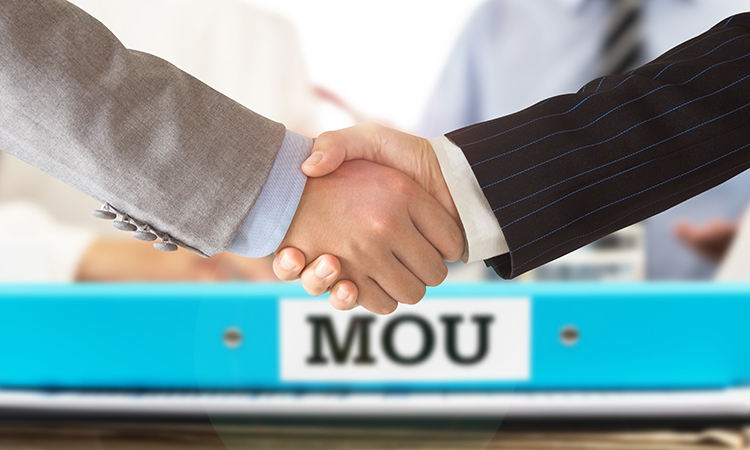 Businessman handshake on mou - memorandum of understanding