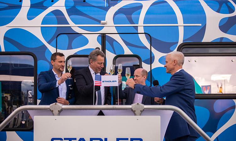 Speakers Martin Ritter (CEO at Stadler US), Dr. Ansgar Brockmeyer (Executive Vice President  Marketing & Sales of the Stadler Group), Chad Edison (Chief Deputy Secretary for Rail and Transit at CalSTA) and Matt Sibul (Director of Sales and Program Development at Stadler US) toast to celebrate the signature of the Memorandum of Understanding. 