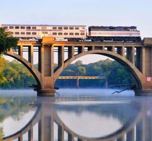 A Virgina Railway Express commuter train passing over the Rappahannock River.