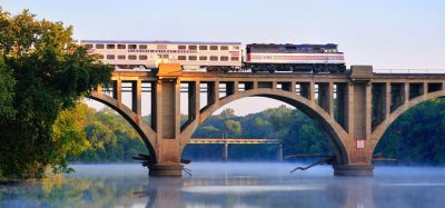 A Virgina Railway Express commuter train passing over the Rappahannock River.
